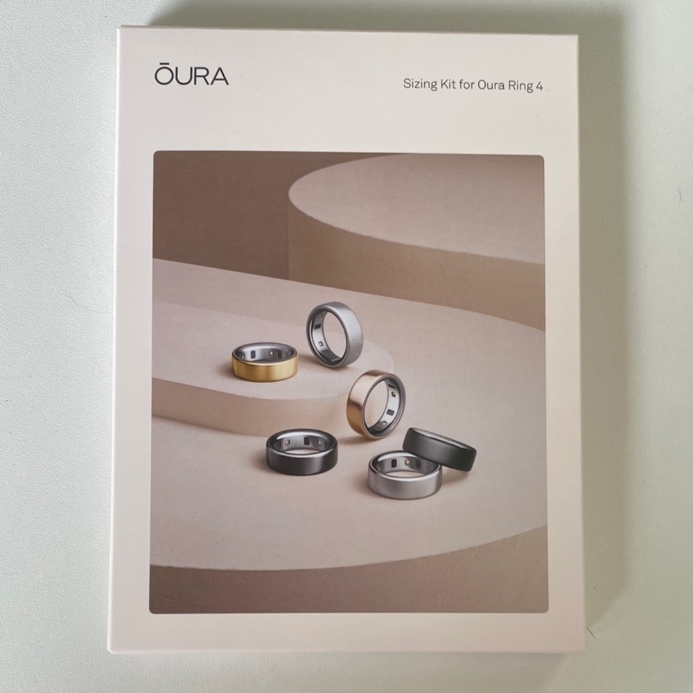 Oura Ring sizing kit with black, silver, gold rings